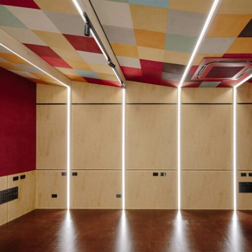 Auditorium with peel n stick tiles multicoloured on ceiling