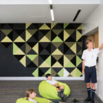 Green and black Peel n Stick Acoustic Panels in a school