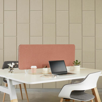 Woven image balance acoustic panels on wall with workstation and chairs in front