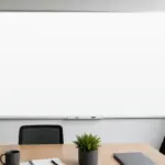 Large wall-mounted whiteboard in a modern meeting room